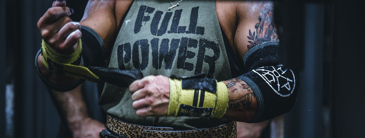 Weight lifter with a t-shirt with the words Full Power